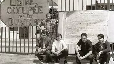 french workers with placard during occupation of their factory